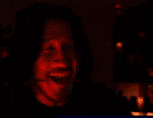 a blurry picture of a man in a dark room