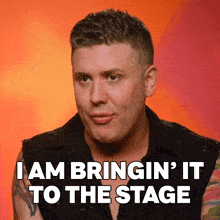 a man in a black vest says i am bringin ' it to the stage