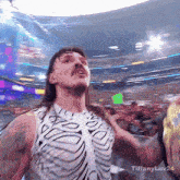 a man in a skeleton costume stands in front of a crowd with the words tiffanyluv24 written below him