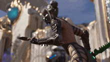 a statue of a woman holding a green sword