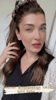 a close up of a woman 's face with the words gold babe below