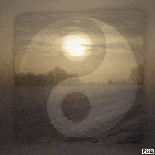 a picture of a yin yang symbol with the sun in the middle