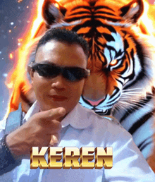 a man wearing sunglasses stands in front of a tiger with the name keren written in gold letters