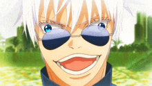a close up of a person wearing sunglasses and smiling .
