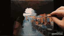 a painting is being painted on a canvas with the words made in animatica