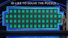 a woman is standing in front of a puzzle board on a game show and says `` id like to solve the puzzle '' .