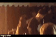 a group of people are sitting in a dark room with imgflip.com at the bottom of the image