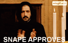 a man giving a thumbs up in front of candles with snape approves written below him