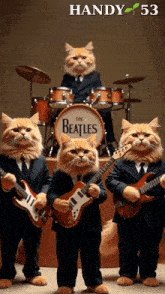 a group of cats dressed up as the beatles