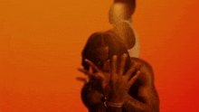 a blurry picture of a man with a ring on his finger