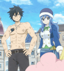 a man without a shirt is standing next to a girl
