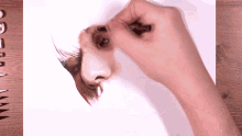 a person is drawing a woman 's face with a marker that says prismacolor