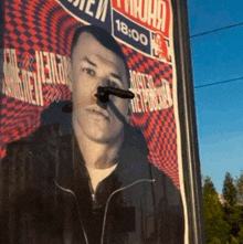 a picture of a man with a gun sticking out of his nose with the time 18:00