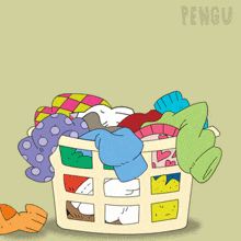 a penguin is sitting in a laundry basket