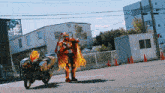 a man in a fire costume is standing next to a motorcycle in a parking lot