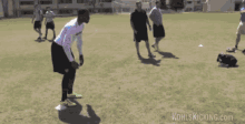 a blurred image of a person throwing a ball with kohlskicking.com written in the corner