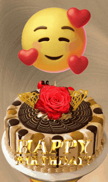 a happy birthday cake with a smiley face and a rose on top