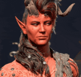 a close up of a demon 's face with horns and ears