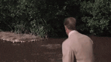 a person is splashing in a puddle of water .