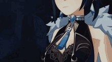 a close up of a girl 's neck and chest with a blue tie