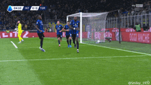 a group of soccer players celebrate a goal during a game sponsored by sky sport