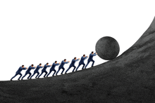 a group of men pushing a large stone up a hill