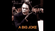 a poster of the joker with the words " a big joke " on the bottom