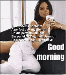 a woman is laying on a couch with a cup of coffee and a good morning greeting