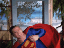 a blurry picture of a man in a superman outfit