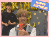 a man holding a red cone with the words happy birthday behind him