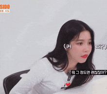 a woman wearing a white shirt that says i love gurls