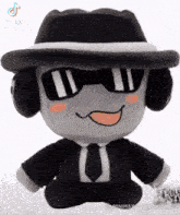 a stuffed animal wearing a hat and headphones