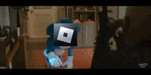 sonic the hedgehog is standing in a living room with a roblox icon on his head .