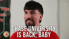 a man with a beard is smiling with the words chase university is back baby behind him