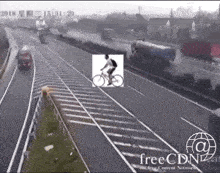 a picture of a man riding a bike on a highway with the year 2018 on the bottom