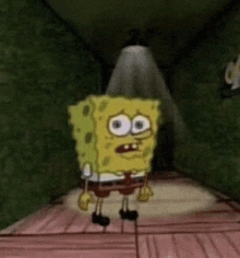 spongebob squarepants is standing in a dark hallway with a light shining on him .