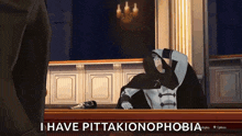 a man in a cape is sitting in a courtroom with the words i have pittakionophobia written above him