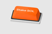an orange button with the words stake sol on it