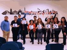 a group of people holding up signs with the letters cero on them