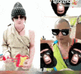a man wearing a hat and sunglasses is next to another man wearing monkey slippers