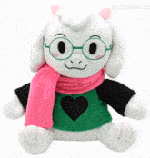 a stuffed animal wearing glasses and a pink scarf with a heart on it