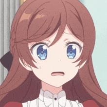 a close up of a girl 's face with a surprised look on her face