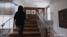 a woman is walking down a set of stairs made by animatica