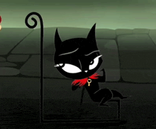 a black cat with a red scarf around its neck has a key around its neck