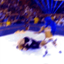 a blurry picture of two wrestlers in a wrestling match