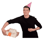 a man wearing a party hat is holding a gift with the words happy birthday written above him