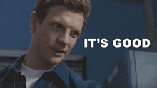 a man in a blue shirt is smiling with the words it 's good above him