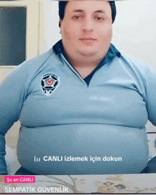a man in a blue shirt with the word canli on the bottom right
