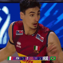 a man in a red jersey with ita on it
