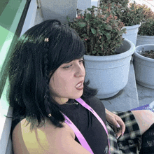a woman with a lanyard around her neck that says ' a ' on it